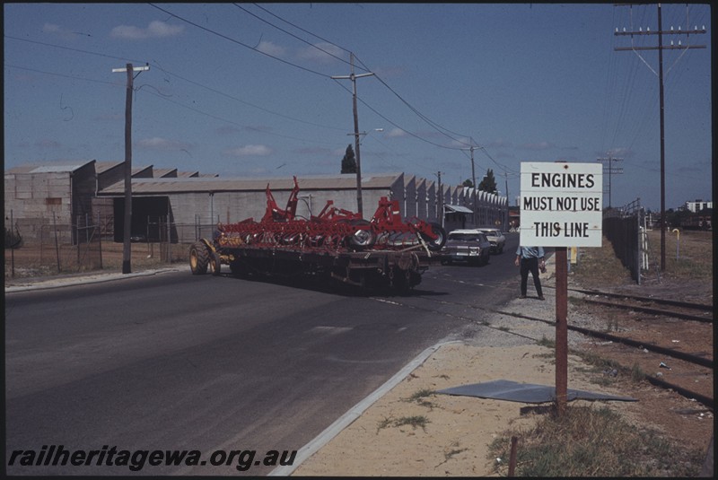 P13190
Tractor moving a bogie flat wagon loaded with agricultural implements across Whately Crescent from the Massey Ferguson plant at Maylands
