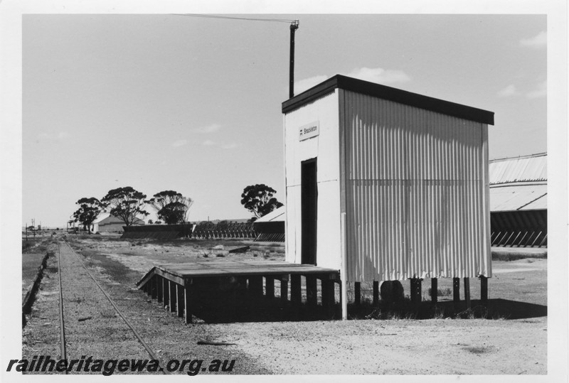 P13240
Out of shed with nameboard, elevated behind a raised platform, Shackleton, YB line, front and side view of shed.
