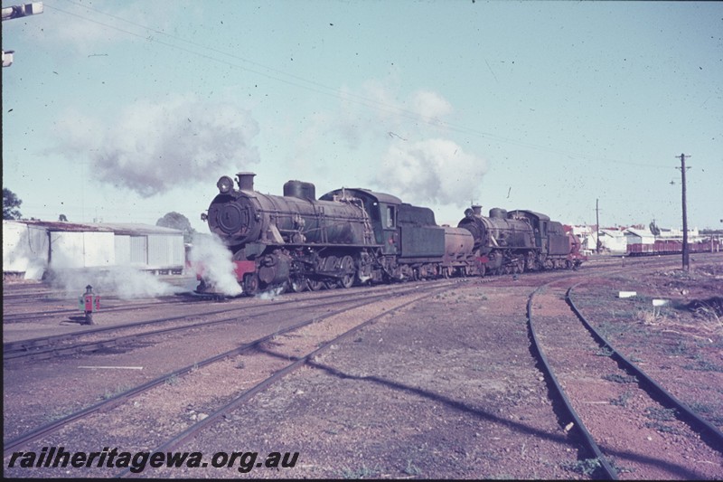 P13312
W class 916 coupled with another W class with a four wheel tank wagon between, them leaving the Wagin loco depot, GSR line
