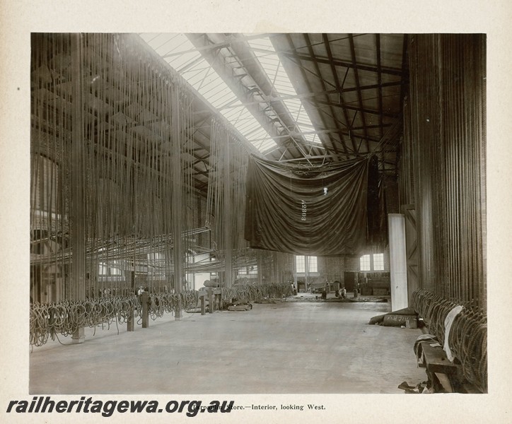 P13411
55 of 67 views taken from an album of photos of the Midland Workshops c1905. Tarpaulin Store, - Interior, Looking West.
