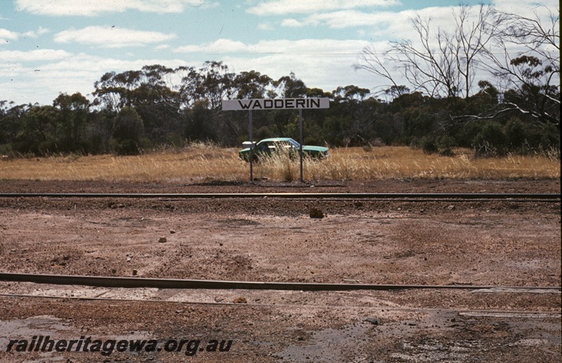 P13450
Station nameboard, Wadderin, NKM line, view across the tracks
