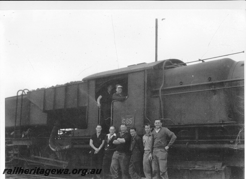 P13472
2 of 3 images taken at Norseman, CE line, of the last steam working on the Coolgardie to Esperance line, ASG class 65 hauled ASG class 55 dead on No.156 goods ex Norseman. Fireman Barry Wintle and driver Ted Bates in the cab, left to right in front of the cab are driver Ron Bradshaw, fireman grey Mcintyre, guard Bill Waller, driver Josh Downey, fitter Bill Rayner, fireman Tom Berg and driver Ken Nichols. 
