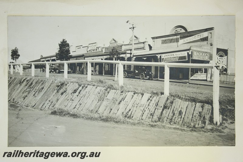 P13484
2 of 9 images of the buildings and structures at Bayswater Station, ER line, view shows the shops in the street adjacent to the station.
