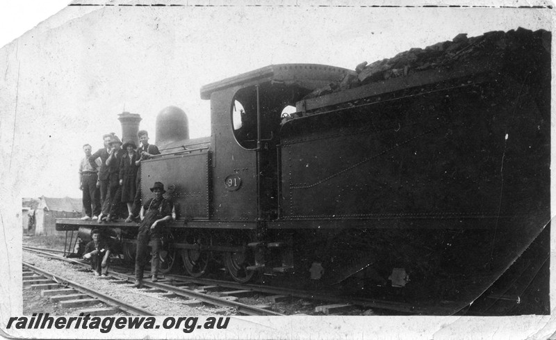 P13512
7 of 7 images of O class 91, date and location Unknown, view taken from the rear of the loco looking towards the front, group on the running board.
