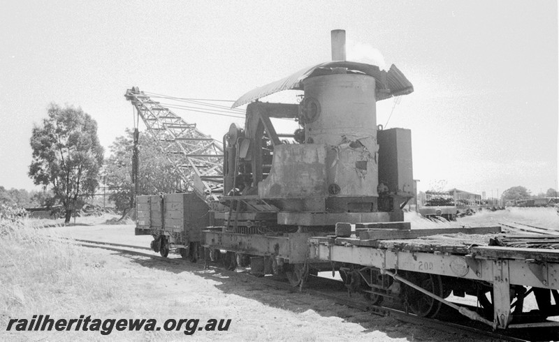 P13520
6 of 6 images of steam crane No.27, Jetty wagon No.200 behind, GC class 40218 in front, side and end view, Midland Workshops.
