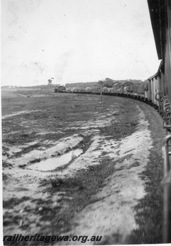 P13528
PR class steam loco hauling a goods train, view along the train taken from the brakevan
