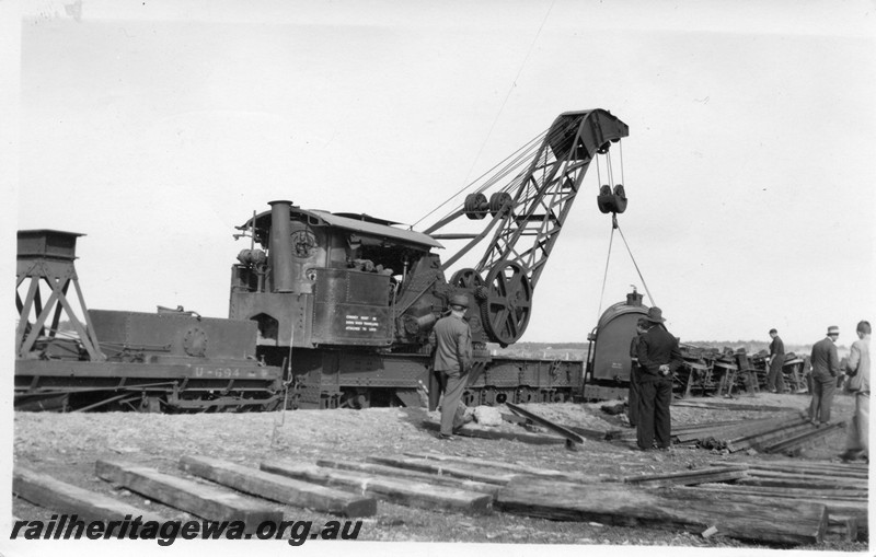 P13531
1 of 3 views of the derailment at Dumberning, BN line showing steam crane No.23 lifting wagons back onto the track.
