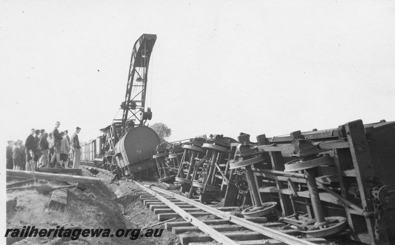 P13533
3 of 3 views of the derailment at Dumberning, BN line showing steam crane No.23 lifting wagons back onto the track.
