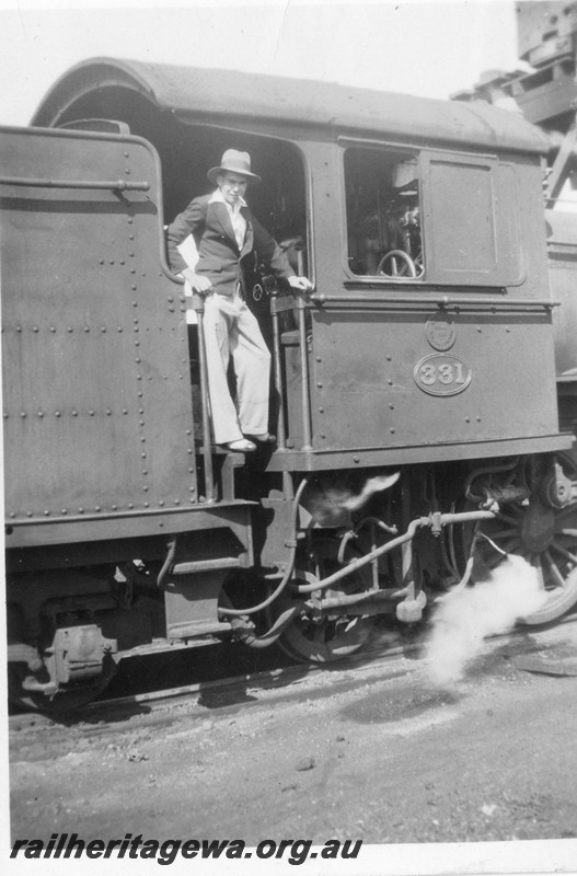 P13535
E class 331 with a self trimming tender, view of cab with Harold Tower standing in the doorway
