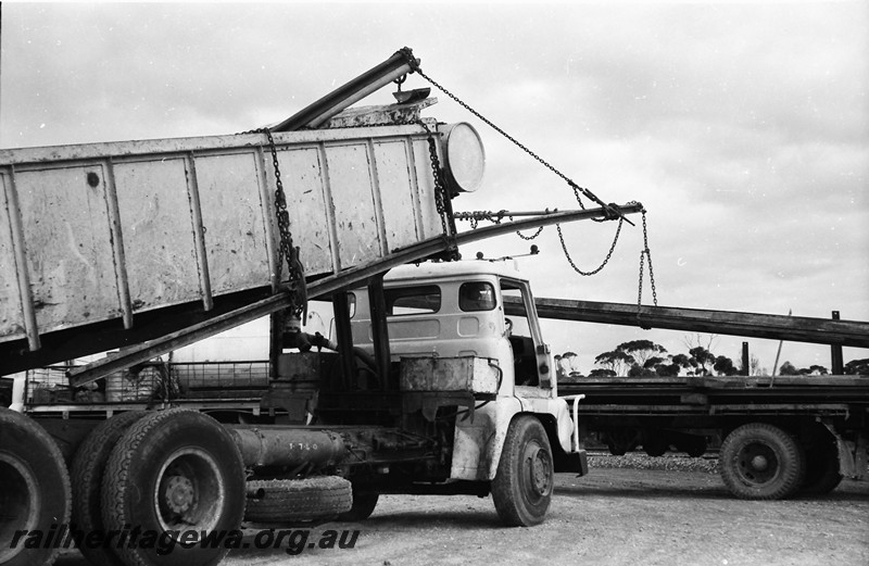 P13552
1 of 4 images of loading/unloading rails at Beete, CE line, tip truck being used as a crane to lift the rails
