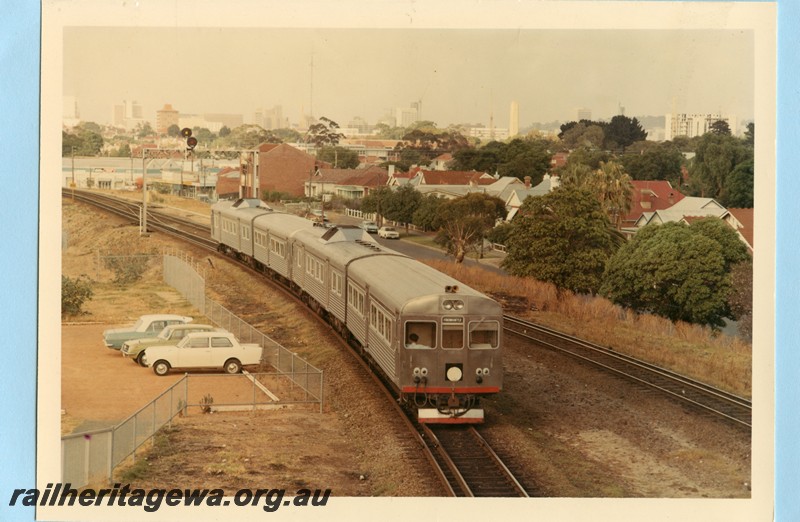 P13584
ADK/ ADB class four car railcar set, signal gantry with searchlight signals, departing Mount Lawley for East Perth
