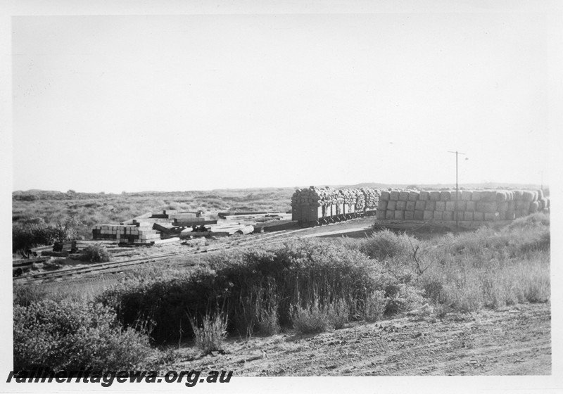 P13598
Wagons loaded with bags of blue asbestos, Point Samson
