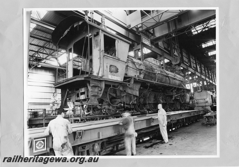 P13607
W class 901 less tender on standard gauge flat wagon being prepared for transportation to South Australia, Midland Workshops
