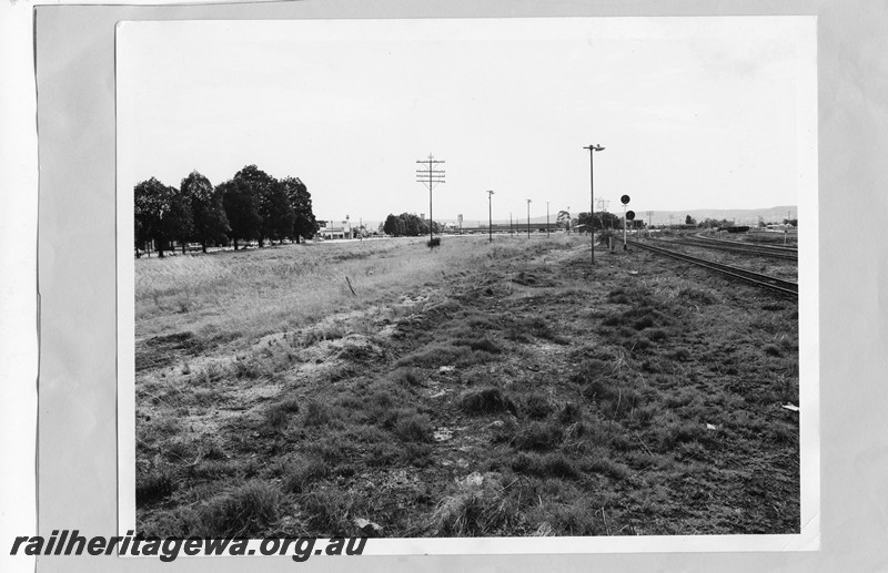 P13648
Site of the MRWA workshops after their removal, distant overall view looking east, town hall clock tower can be seen in the background
