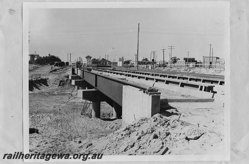 P13659
Steel girder bridge over the Great Eastern Highway at Rivervale, SWR line, subway under construction, station building and the signal box in the background. 
