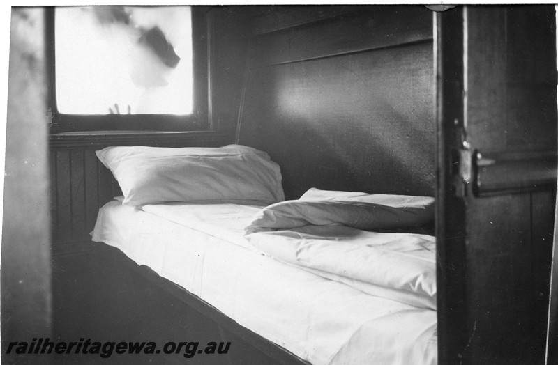 P13673
AQ class sleeping carriage, internal view of a compartment with the bed made up.
