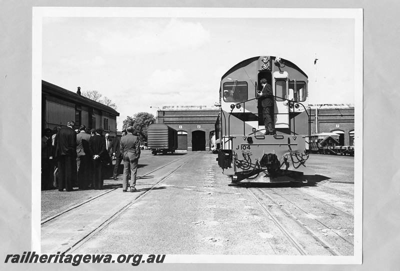 P13714
J class 104 in International Safety livery, dignitaries looking on, forecourt, Midland Workshops, end view
