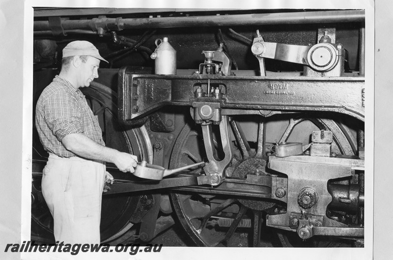 P13734
Driver oiling the motion on a PM class loco, 
