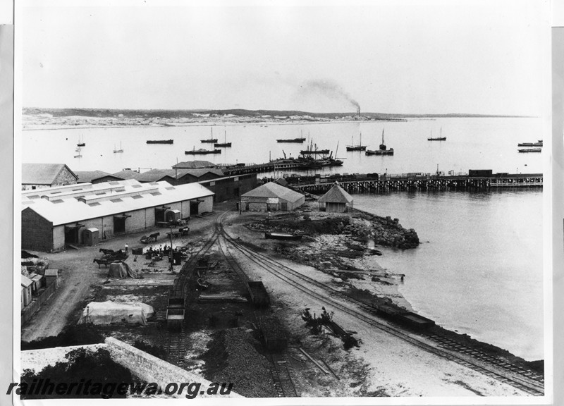 P13739
Jetties, rail tracks, horse drawn vehicles, early elevated view of Fremantle harbour.
