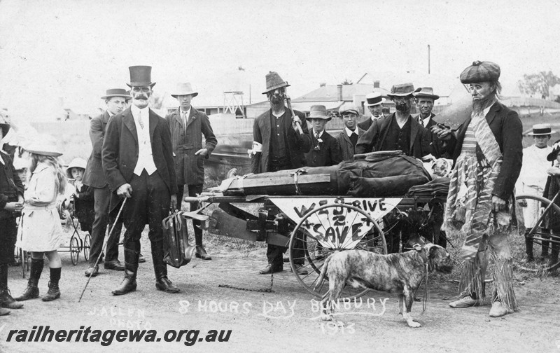 P13760
Railway workers in fancy dress, effigy on a stretcher trolley, to celebrate 