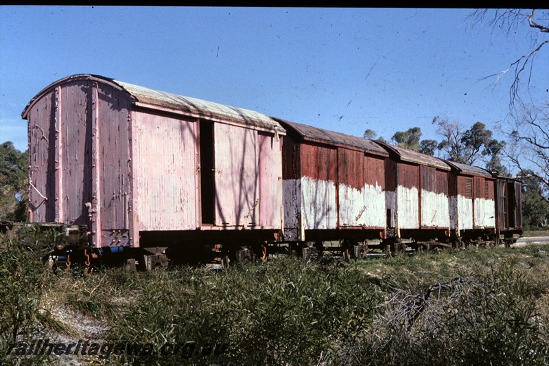 P13769
1 of 9 views of the abandoned and derelict D class, DA class and DE class vans at the Woodman Point munitions depot, line up of 4 vans
