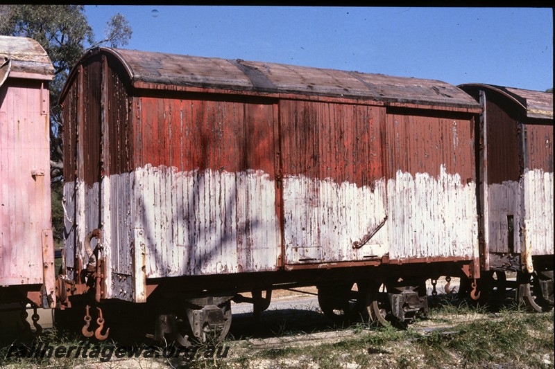 P13771
3 of 9 views of the abandoned and derelict D class, DA class and DE class vans at the Woodman Point munitions depot, side view.
