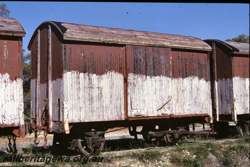 P13772
4 of 9 views of the abandoned and derelict D class, DA class and DE class vans at the Woodman Point munitions depot, DE class van, end and side view.
