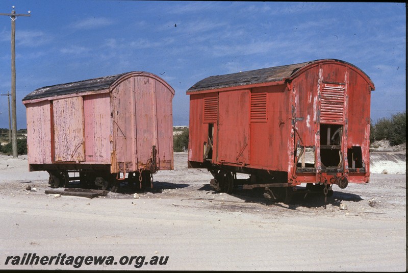 P13775
7 of 9 views of the abandoned and derelict D class, DA class and DE class vans at the Woodman Point munitions depot, DE class 61 and DA class 10956, side and end views.
