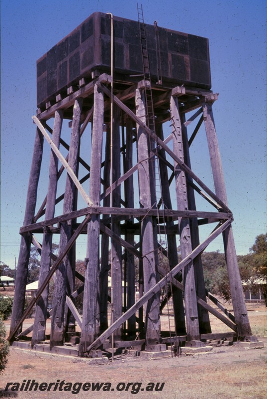 P13822
Water tower with a painted black 25,000 gallon cast iron  tank, Cunderdin, preserved, two sides in view
