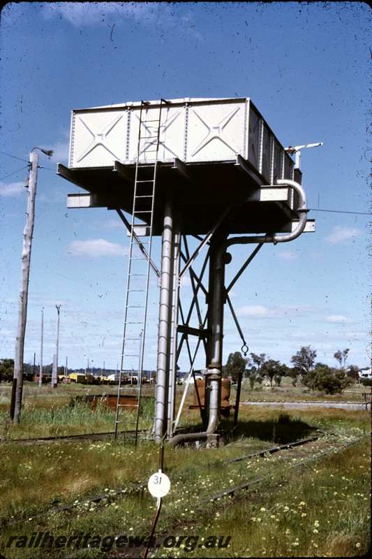 P13828
Water tower, Collie, BN line, rectangular tank with central uprights.

