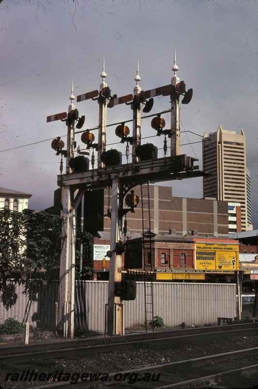 P13835
Bracket signal with four arms and four dollies, with twin uprights, near Pier street, Perth, on the south side of the tracks.
