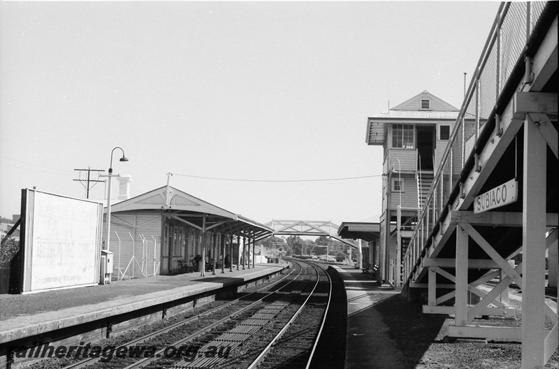 P13880
3 of 6 views of the station buildings at Subiaco, station building, signal box and footbridge at the Perth end, view looking west.
