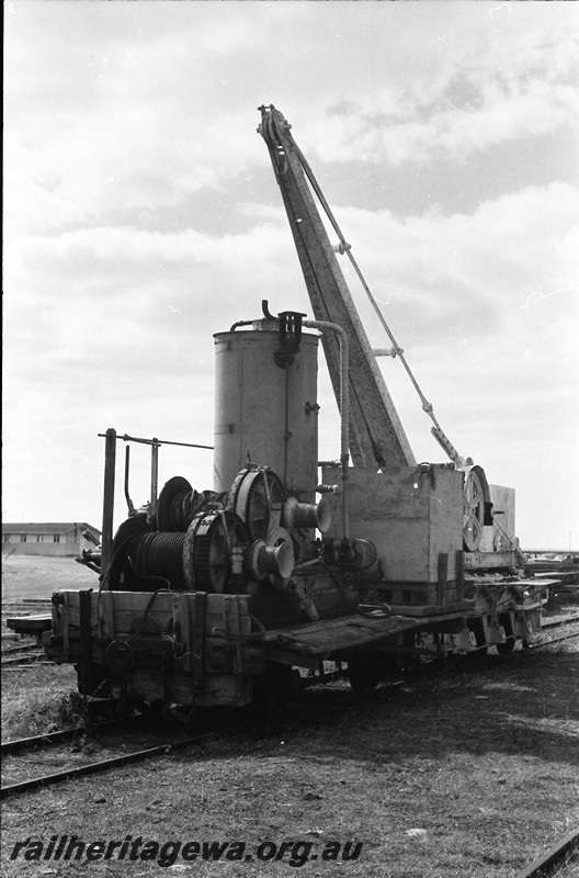 P13935
12 of 32 images of the railway and jetty precincts of Busselton, BB line, steam winch mounted on a four wheel flat wagon, Cowans Sheldon six wheel hand crane coupled behind, end and side view.
