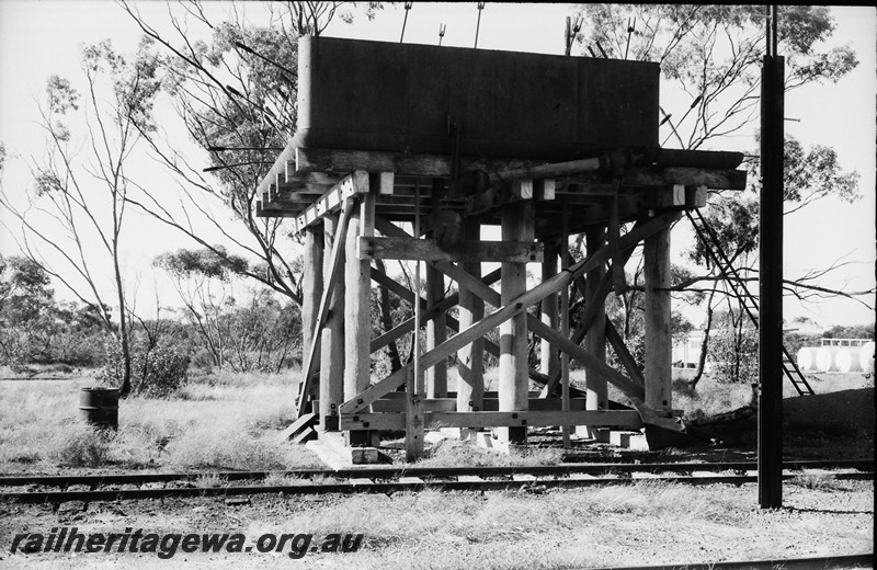 P14056
Water tower, cast iron water tank with only one side and the bottom and internal struts showing, water tank being erected or demolished.
