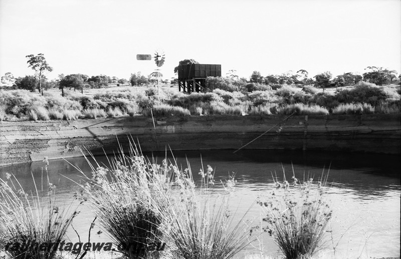 P14059
Dam, round, water tower, 25,000 gallon cast iron water tank, Southern Cross windmill, Bardoc, KL line.
