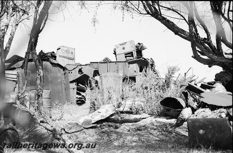 P14079
2 of 3 Remnants of locos and rolling stock at the salvage yard Midland Workshops. 
