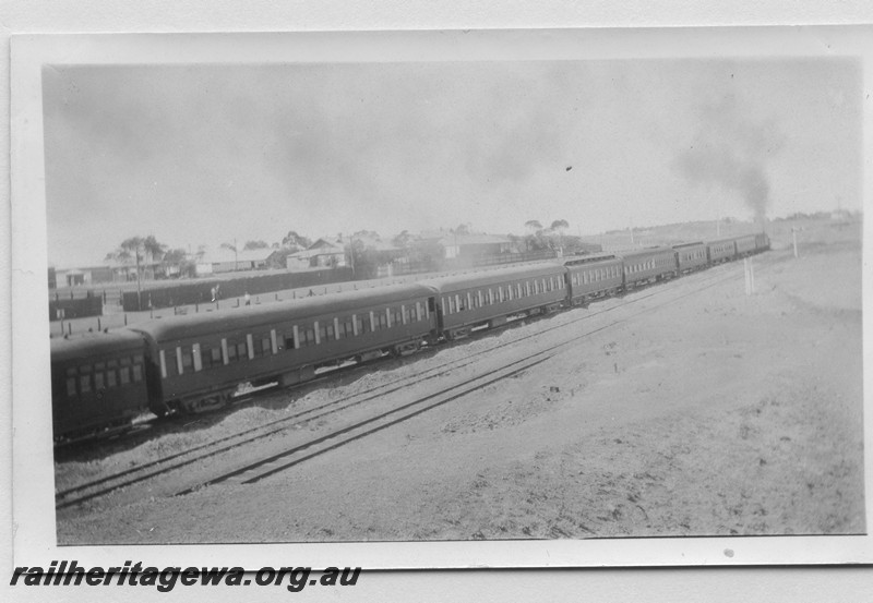 P14182
Commonwealth Railways (CR) passenger train departing Kalgoorlie, TAR line, view along the train looking towards the loco
