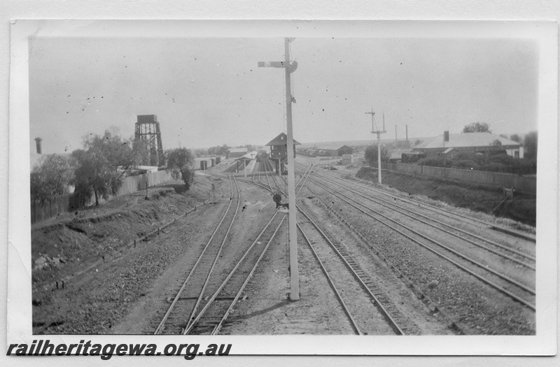 P14183
Signal, signal box, water tower, yard, Kalgoorlie, EGR line, view from the Maritana Street Bridge looking west
