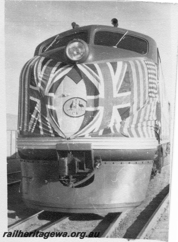 P14185
Commonwealth Railways (CR) GM class diesel loco, front on view, nose of loco adorned with flags of Britain and the USA
