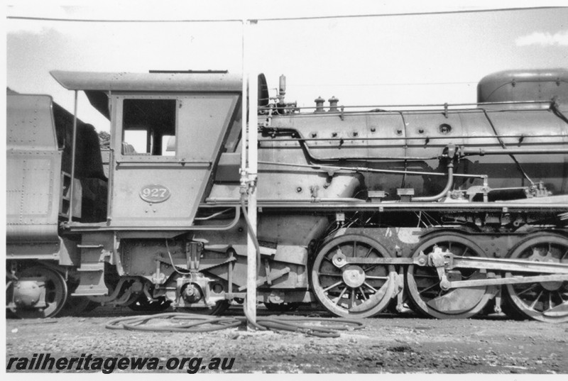 P14199
W class 927, Kalgoorlie loco depot, EGR line, as new condition, side view of the cab and firebox.
