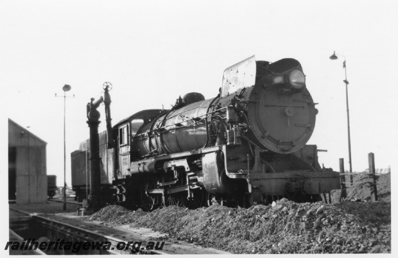 P14216
Commonwealth Railways (CR) C class 63, water column, Parkeston Locomotive Depot. side and front view
