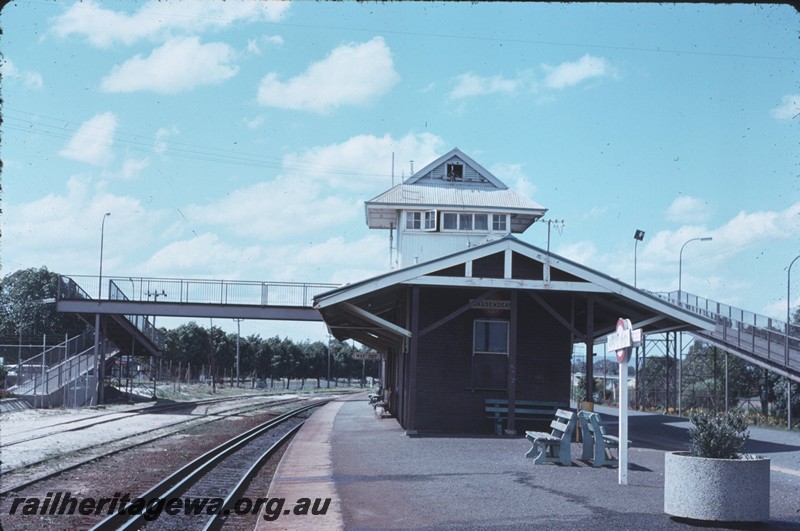 P14262
4 of 4, Station building, signal box, island platform, end view, seats, nameboard, footbridge, Bassendean, ER line.
