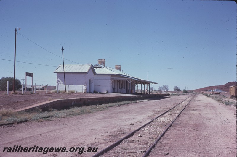 P14267
Station buildings, end and front view, nameboard, platform, Cue, NR line.
