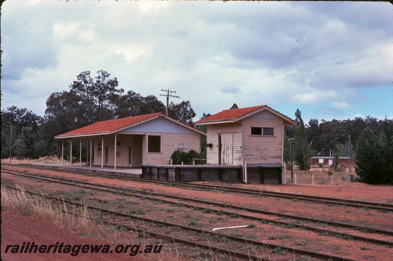 P14274
Station buildings, end and front view, nameboard, rail level platform, loading platform, Dwellingup, PN line.
