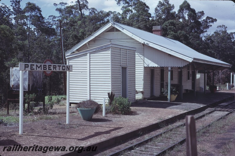 P14275
Station buildings, end and side view, nameboard, platform flower pots, Pemberton, PP line.
