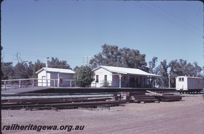 P14280
Station buildings, end and front view, passenger platform, nameboard, VW class workman's van, Mundijong, SWR line.
