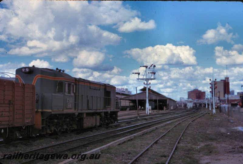 P14305
RA class 1911, side view, signals, sheds, Perth yard, ER line. 
