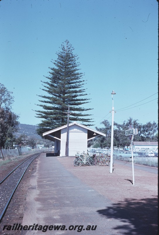 P14314
1 of 3, Station building, end view, nameboard, passenger platform, bicycle rack, Gosnells, SWR line.
