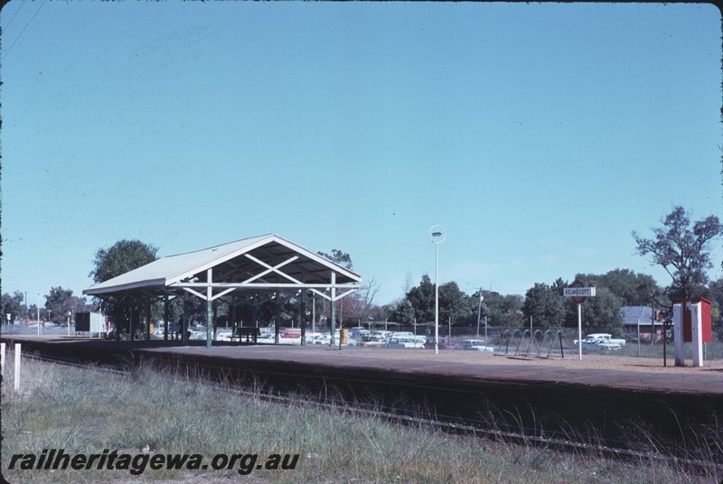 P14317
1 of 2, Station buildings, passenger platform, nameboard, fire hose box, bicycle racks, Kelmscott, SWR line.
