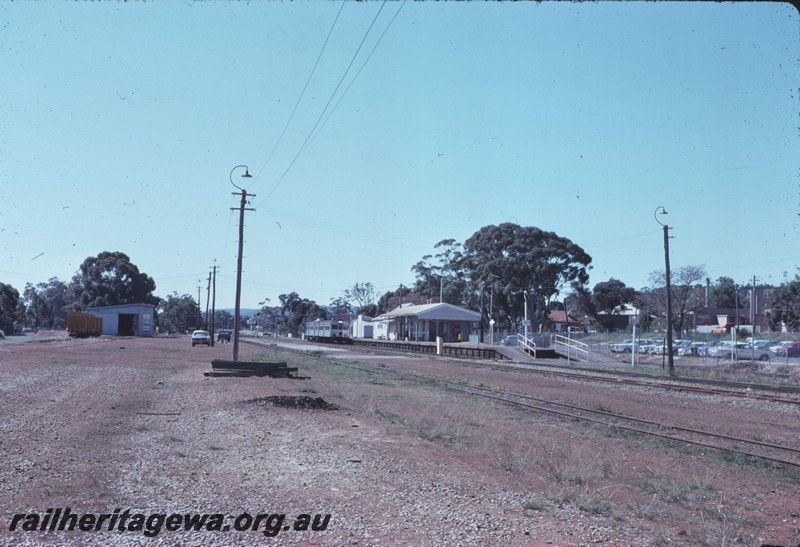 P14320
2 of 6, Station buildings, out-of shed, porter's trolley, station furniture, island passenger platform, nameboard, goods shed, station yard, diesel railcar at the platform, Armadale, SWR line.
